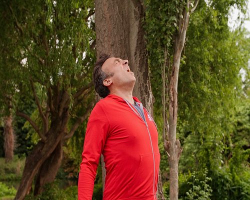 Close up of person practicing deep breathing exercises outdoors